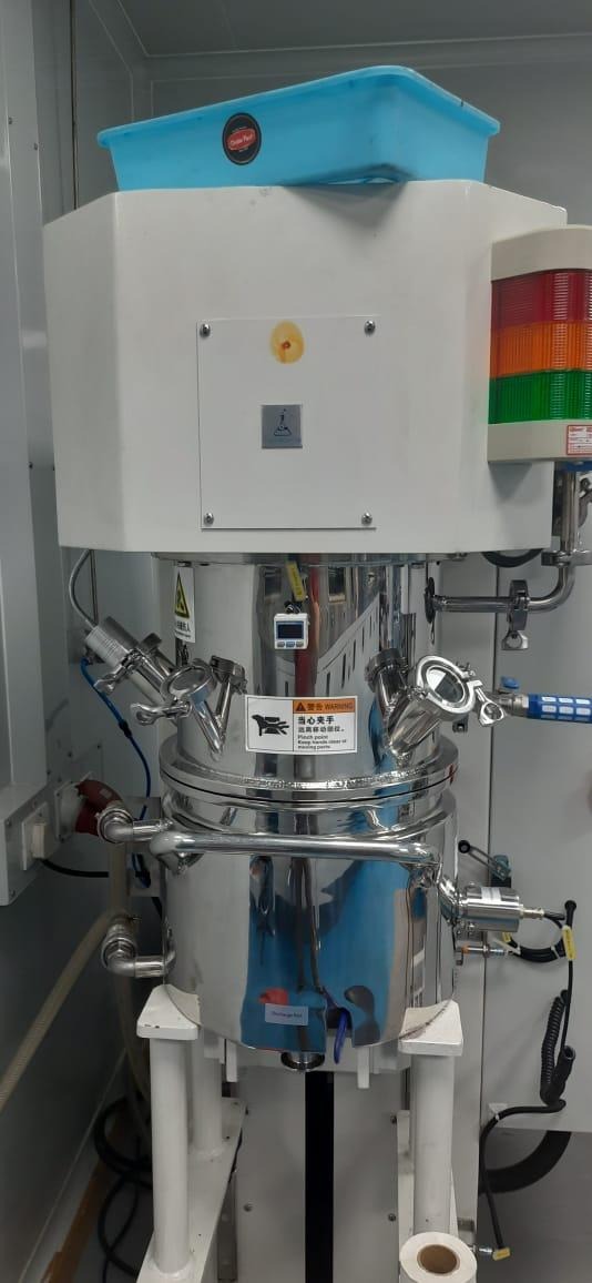 A large metal container with pipes

AI-generated content may be incorrect.