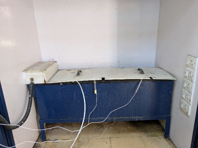 A blue and white box with wires

AI-generated content may be incorrect.