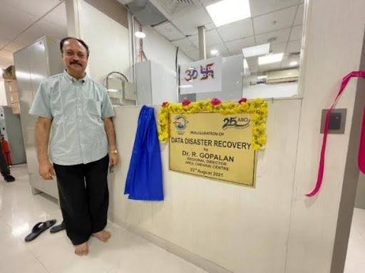 A person standing in front of a sign

AI-generated content may be incorrect.